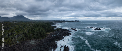 Aerial panoramic seascape view of a rocky Pacifc Coast during a gloomy winter sunset. Taken near Ucluelet, Vancouver Island, British Columbia, Canada.