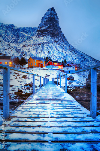 Blue hour. Beautiful winter landscape with traditional Norwegian fishing huts rorbu
