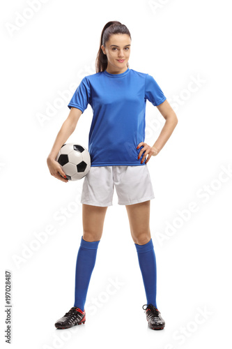 Female soccer player with a football