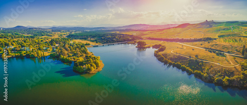 Aerial panorama of beautiful lake and countryside at sunset in Canberra, Australia