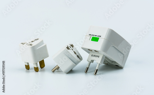 Set of universal plug adapters for travel around the world isolated on white background.