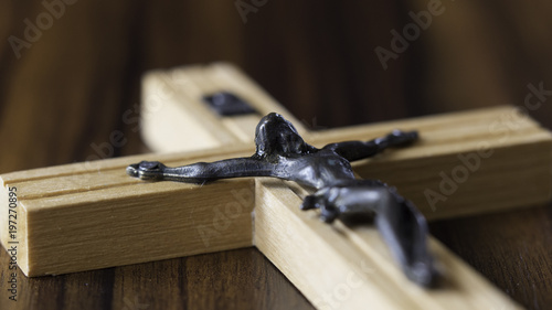 Jesus, I trust you - crucified Jesus on a wooden table background
