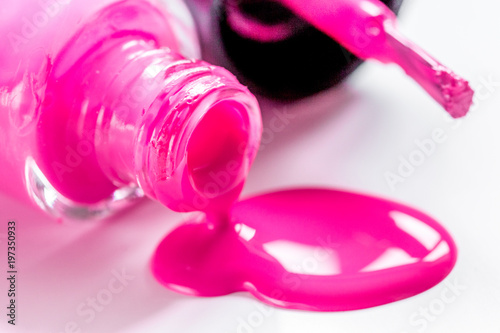 Bottles with spilled nail polish over white background mockup