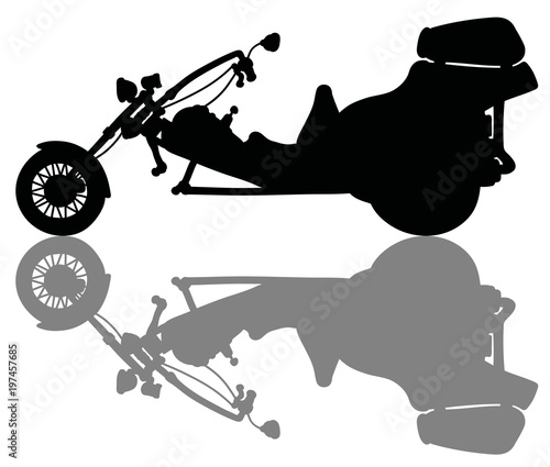 The black silhouette of a heavy motor tricycle