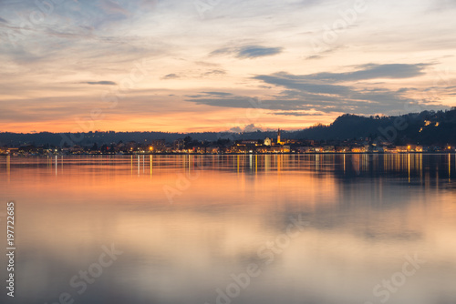 Lake Maggiore, colorful sky at sunset, northern Italy. City of Arona, province of Novara, on the Piedmont side of Lake Maggiore, view from Angera