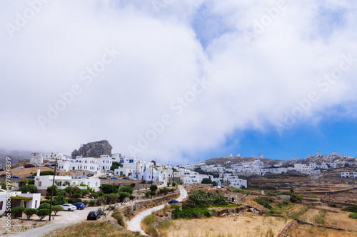 Amorgos, Greece-August 2,2017.A panoramic view of the Chora of Amorgos, the castle on the left and the windmills on the right