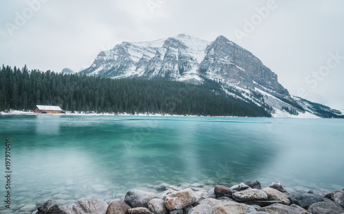 Lake Louise is slowly freezing over in the fall