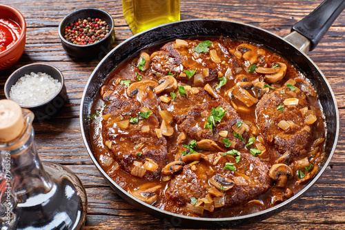 salisbury beef steaks on a skillet