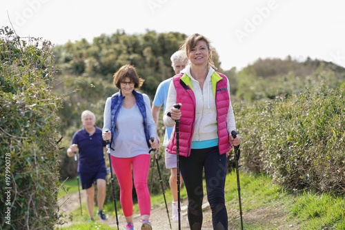 Senior people nordic walking by the atlantic coast