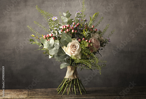 Bouquet of flowers on a wooden table