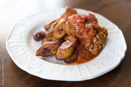 Nigerian Brown Bean Porridge (Ewa Agoyin) with fried Plantain 