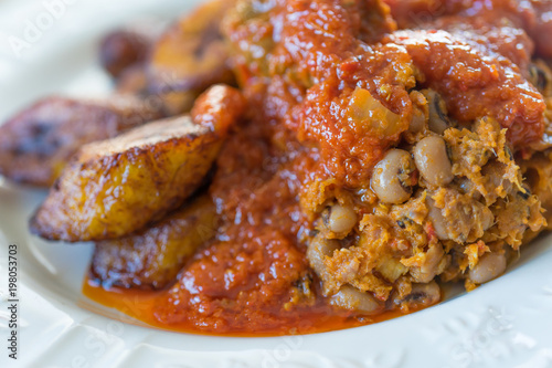 Nigerian Brown Bean Porridge (Ewa Agoyin) with fried Plantain 