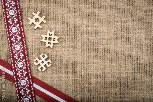 Composition of national latvian patterned ribbons and signs