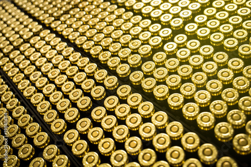 Hundreds of brass ammo rounds lined together