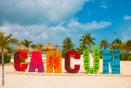 Cancun, Mexico, inscription in front of the Playa Delfines beach. Huge letters of the city name.