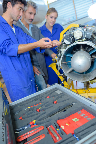 apprentices aeronautical engineers learning with their professor