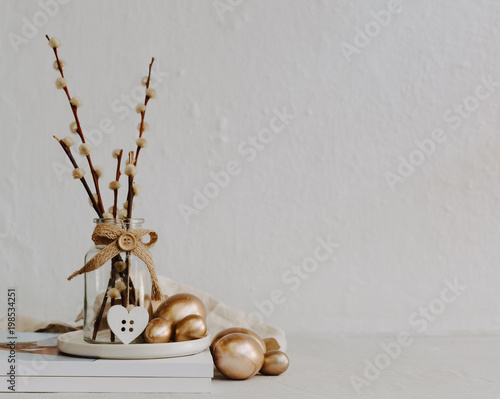 Happy Rustic Easter still life decorations on linen table with copy space