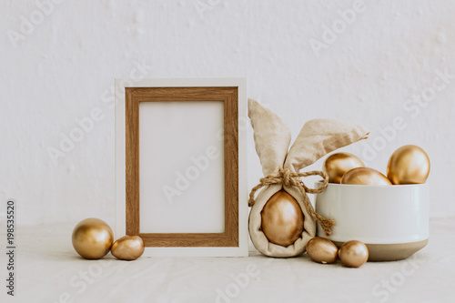 Mock Up Rustic Easter. Frame with gold eggs. Copy Space