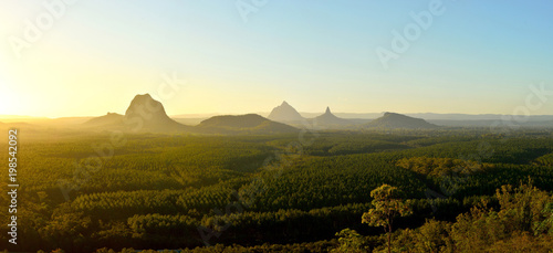 Panoramic view of Glass House Mountains at sunset in Queensland, Australia.