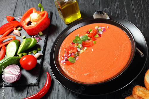 gazpacho in a black bowl, top view