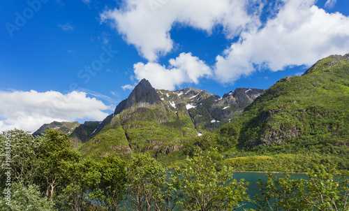 Typical scandinavian landscape with meadows, mountains and fjords. Lofoten islands, Norway.