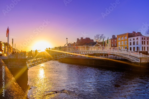 Ha'penny bridge over the river Liffey at sunset, Dublin Ireland, March 2018