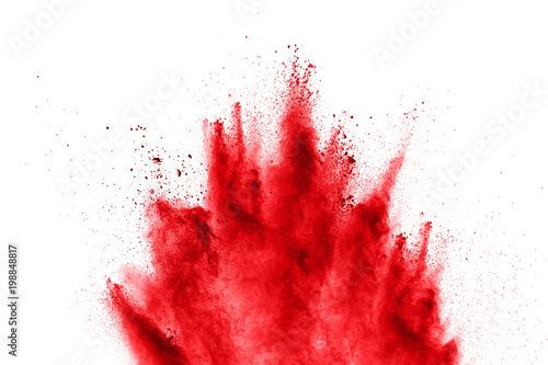 abstract red powder explosion on white background. abstract red dust splattered on background. Freeze motion of red powder splashing.