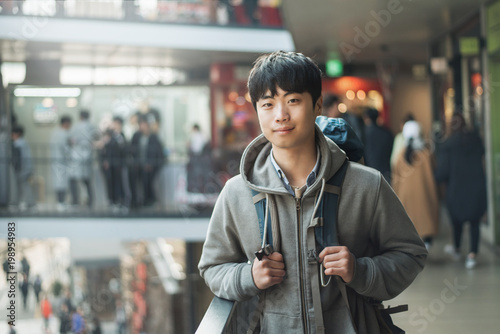 Young man traveling in Korea, Seoul Street