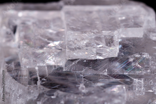 Macro mineral stone Iceland spar on black background