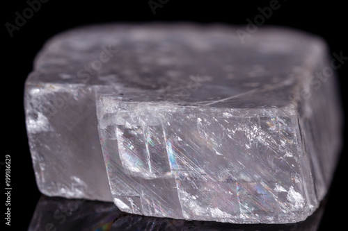 Macro mineral stone Iceland spar on black background