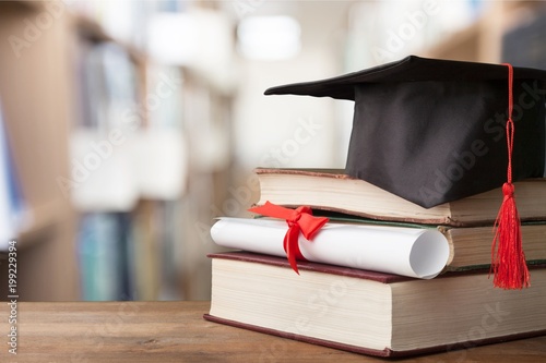 Graduation hat on stack of books