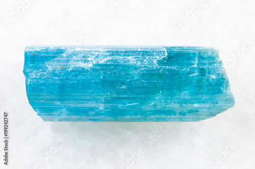 crystal of aquamarine (blue beryl) on white