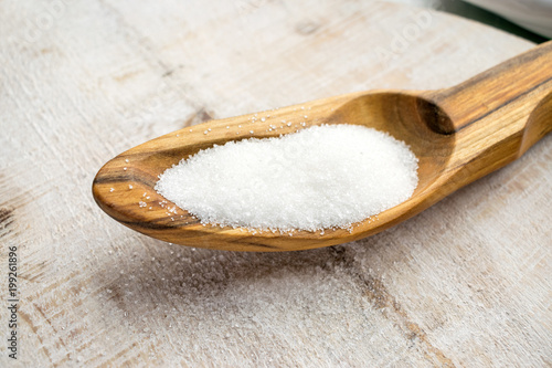 Artificial Sweeteners and Sugar Substitutes in wooden spoon. Natural and synthetic sugarfree food additive: sorbitol, fructose, honey, Sucralose, Aspartame