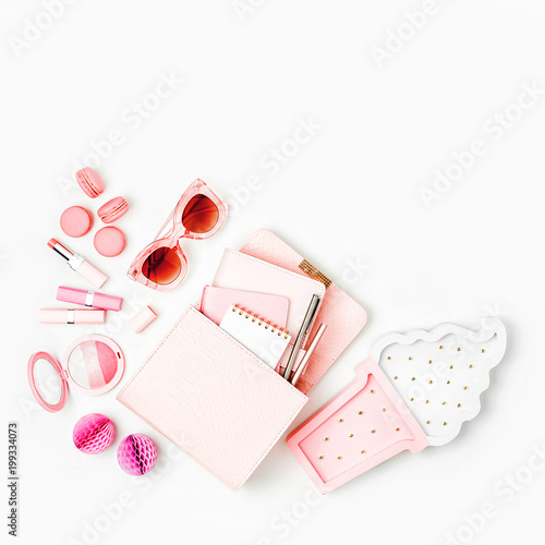 Cosmetic products, sunglass, handbag on white background. Flat lay, top view. Fashion concept