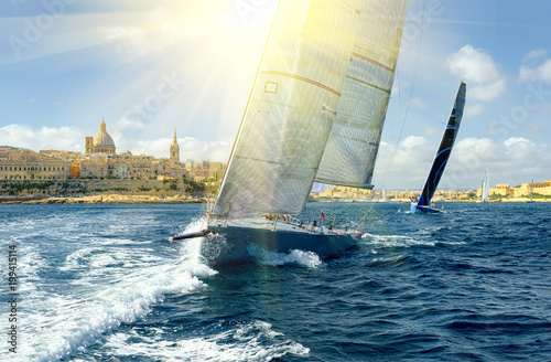 Sailing yachts and sun rays. Sailing. Yachting