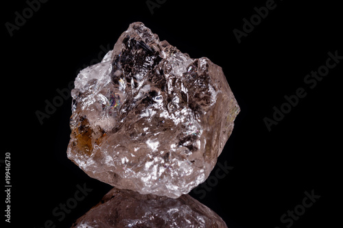 Macro mineral stone smoky quartz Rauch topaz on black background
