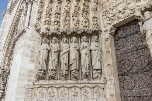 Sculptures and Statues in Main Entrance door of Notre Dame Cathedral in Paris. Ornate Facade, France
