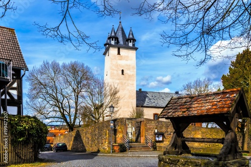 Buildings - The old Protestant church in Ebstorf and the old drinking water well that used to be used for water supply in the Ebdorfergrund in Hesse in Germany.