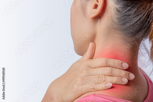 woman pain at trapezius muscle and holding right hand on muscle, swelling and inflammation of left rotator cuff muscle