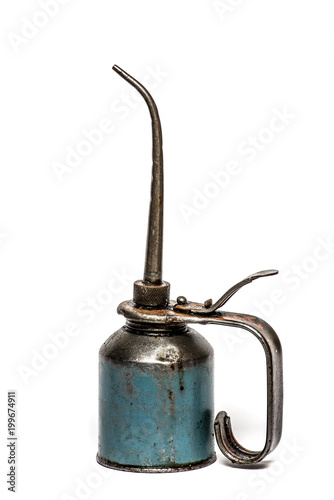 Old, vintage oilcan with long spout, greasy and dirty, textured, isolated on plain white background