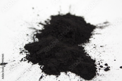 Splash charcoal black powder on white background