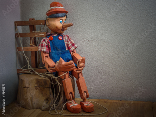 Pinocchio puppet made from wood in vintage tone