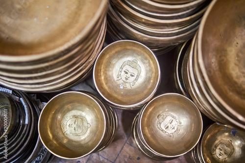 Different size tibetan singing bowls in a market street in Kathmandu, Nepal