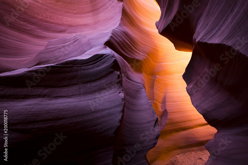 The meandering walls of the underground labyrinth of colored sand of the Lower Antelope Canyon in Page Arizona create unique combinations of light shadows and colors