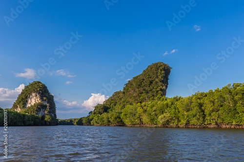 The riverside and mountains : Khao Khanab Nam (paralled hills to water), a symbol of Krabi Province of Thailand.