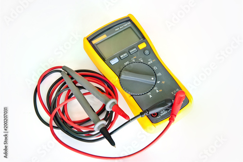 Digital electronic multimeter for students applications. Digital electronic multimeter isolated on the white background.