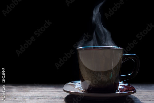 Hot coffee on the wooden table.