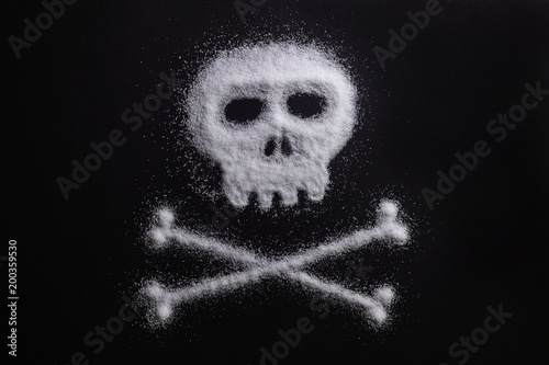 Sugar in the form of a skull and bones. Concept that sugar and sweets are dangerous or cocaine and drugs are fatal deadly and dangerous.