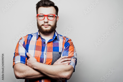 Lifestyle and people concept: Bearded man with his arms crossed