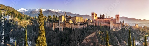 Palace and fortress complex Alhambra with Comares Tower, Palacios Nazaries and Palace of Charles V during sunset in Granada, Andalusia, Spain.